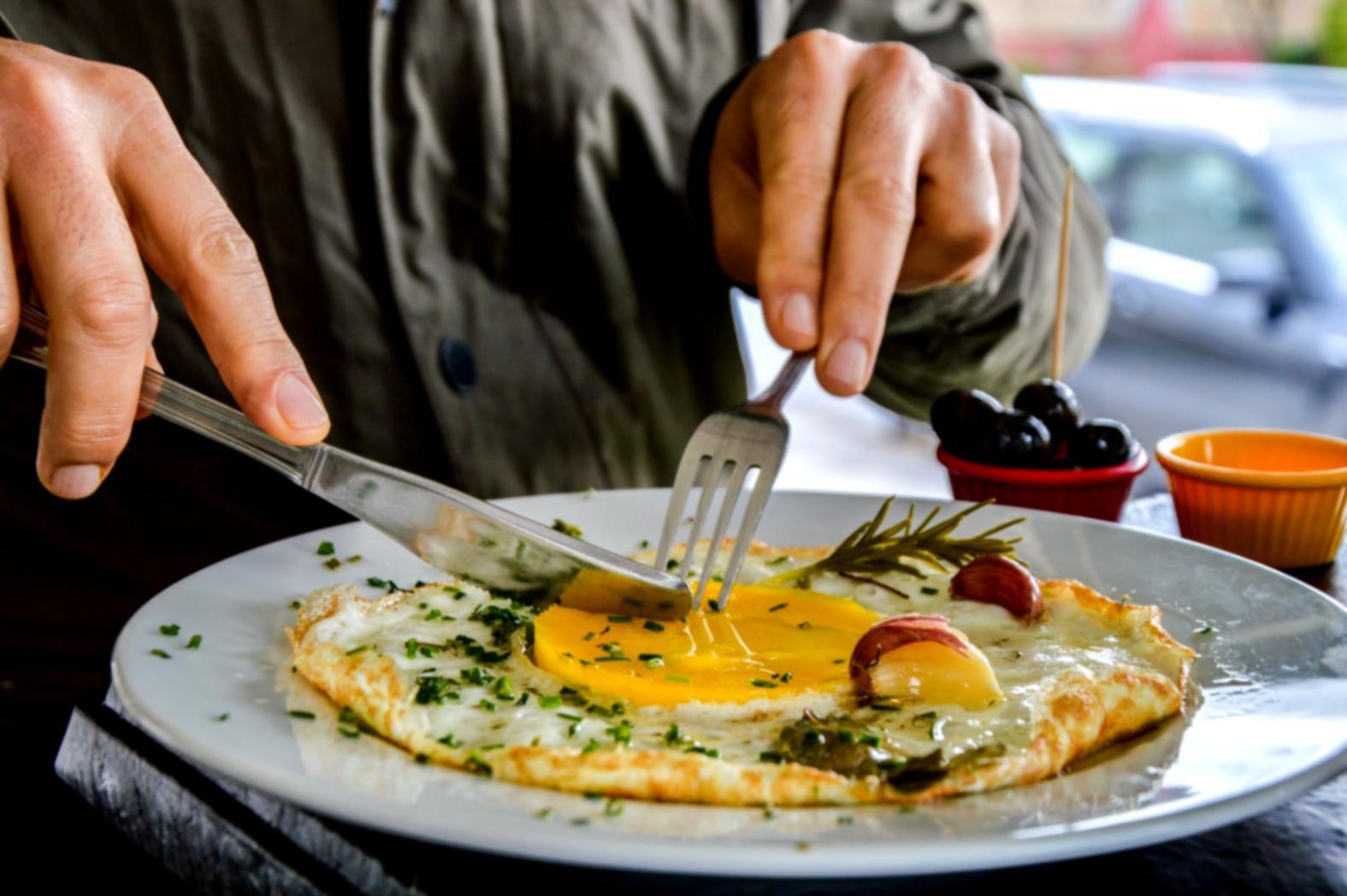 Professional food styling setup showing plating technique demonstration
