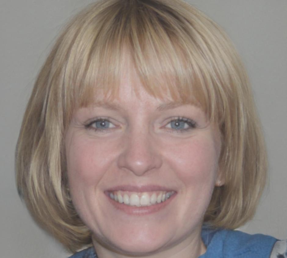 Instructor Maeve Quinlan reviewing student plating work